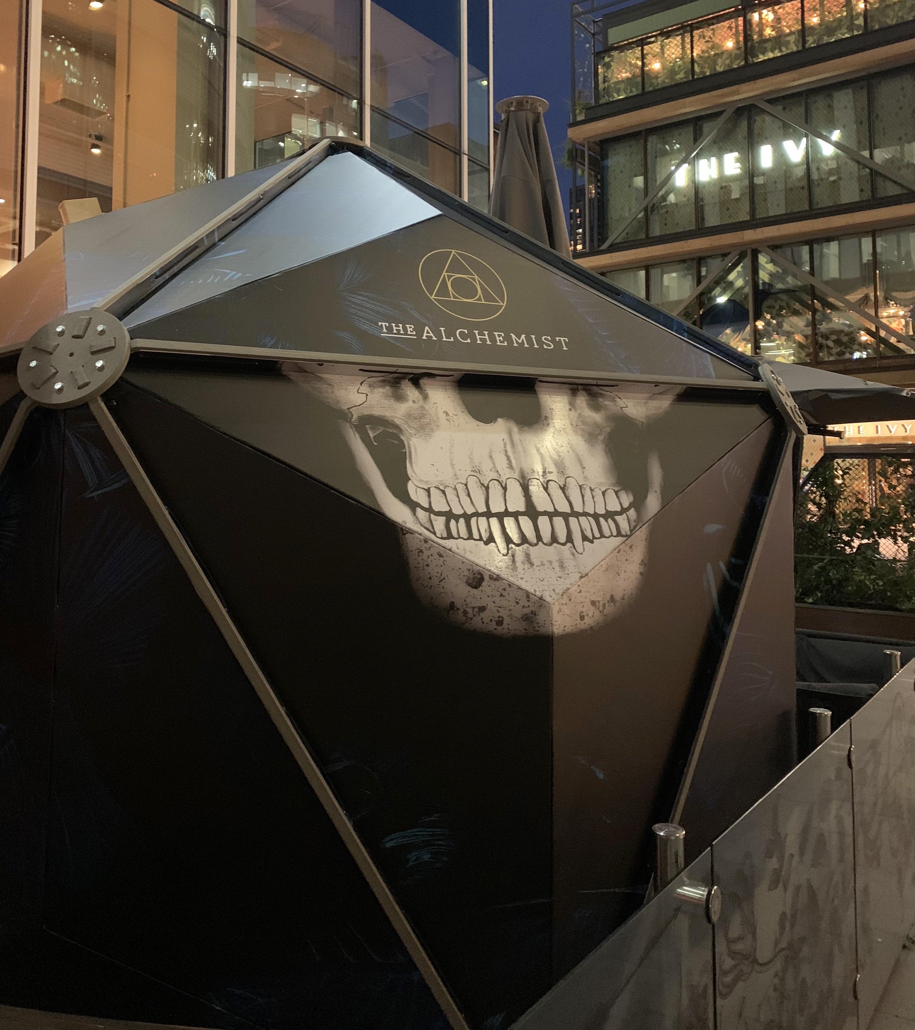 Bacardi GeoDome activation wrapped with a skull graphic and The Alchemist branding at night