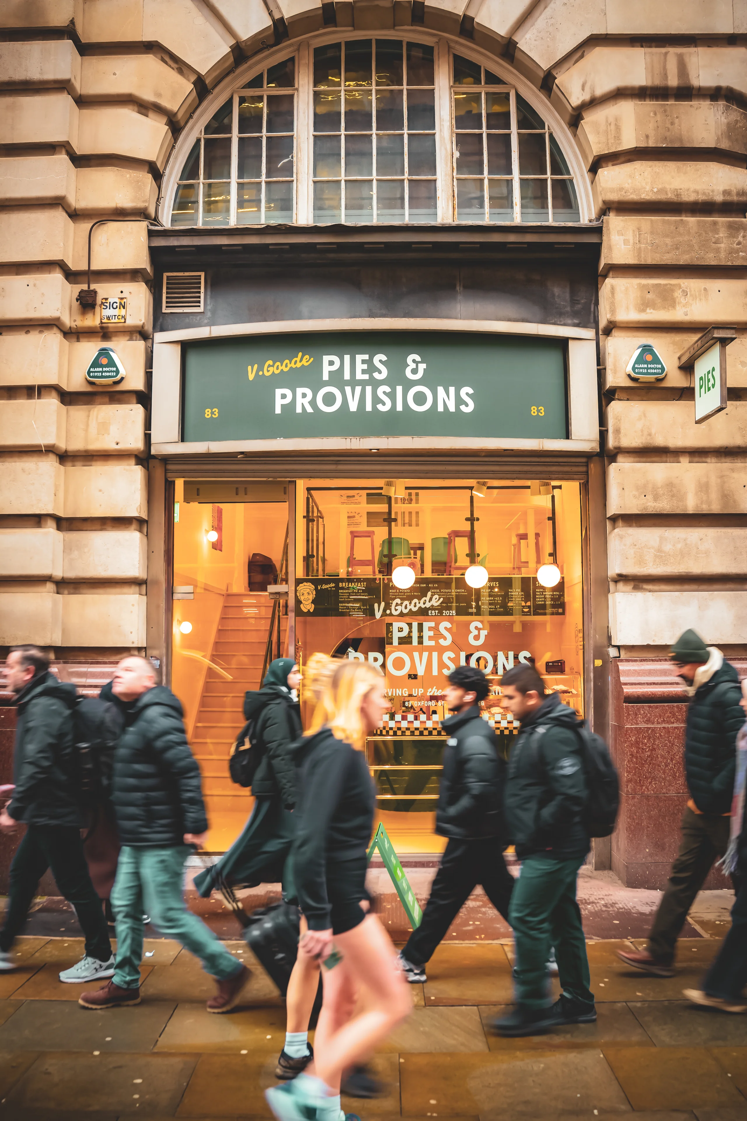 V.Goode Pies and Provisions shopfront with green fascia and window graphics